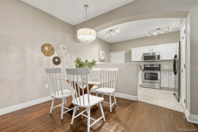 a view of kitchen and dining area with a large window
