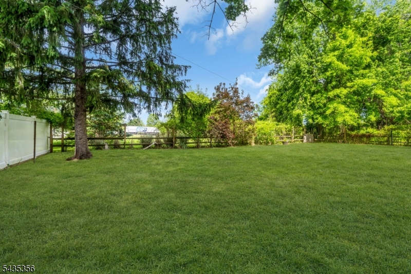 105 Somerville Road Bedminster, NJ 07921 - Photo 33 of 36 a backyard of a house with lots of green space