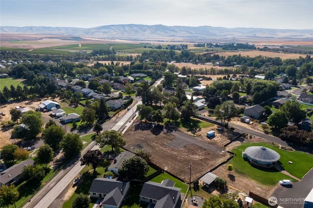 an aerial view of residential houses and outdoor space