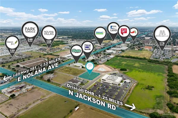 a view of living room with furniture and kitchen view