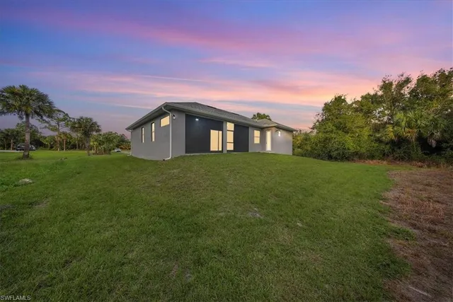 a view of a house with a big yard