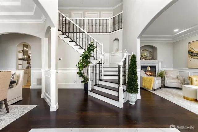 a view of entryway and hall with wooden floor