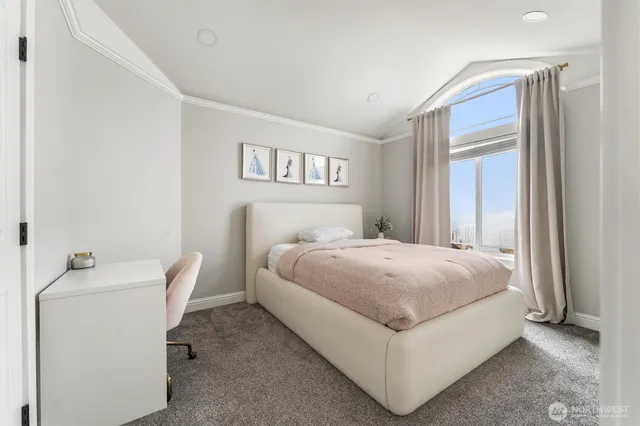 a bathroom with a granite countertop bathtub a sink and a window