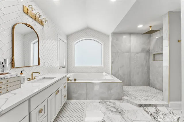 a view of a dining room with furniture and a chandelier