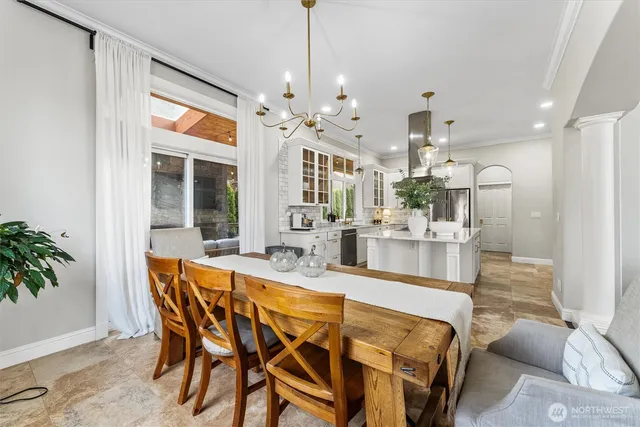 a kitchen with kitchen island granite countertop a sink outdoor counter top space and stainless steel appliances