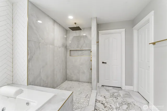 a bathroom with a shower and a sink