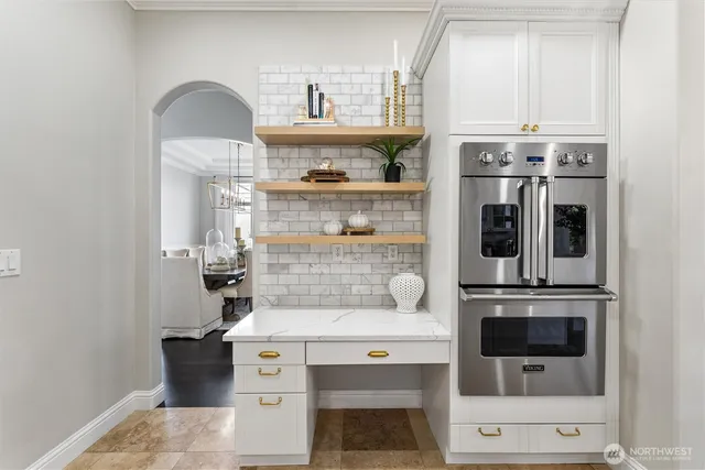 a kitchen with refrigerator a stove a sink and a microwave