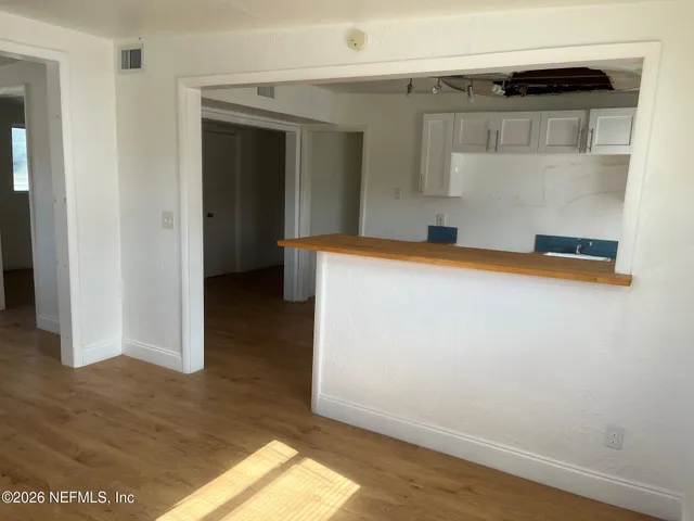 a view of an empty room with a window