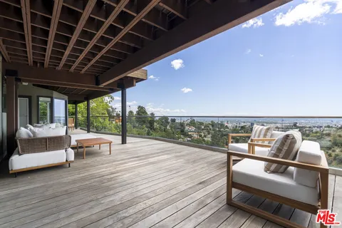 a patio with patio lots of furniture and wooden floor
