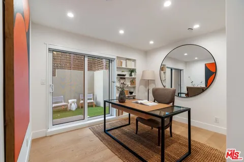 a bathroom with a shower sink and mirror