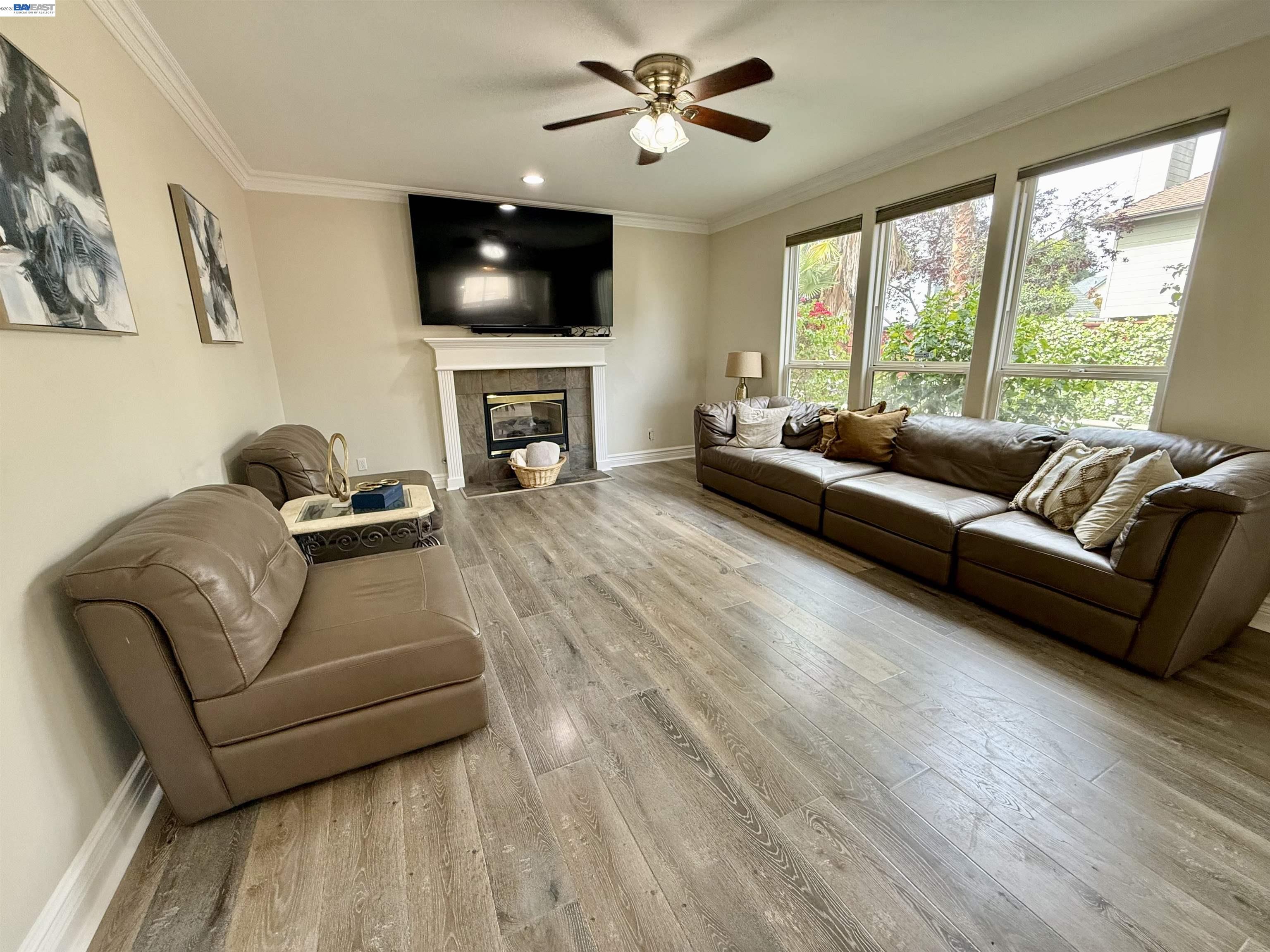 1284 Riesling Circle Livermore, CA 94550 - Photo 28 of 79 a living room with furniture a flat screen tv and a fireplace