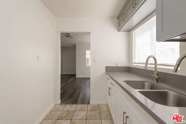 a kitchen with a sink and cabinets