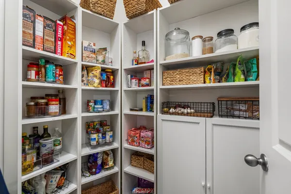 a shelf with books and knick knacks on it