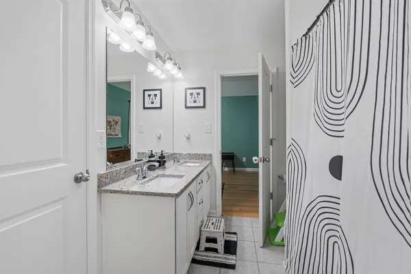 a bathroom with a sink a mirror and a bathtub