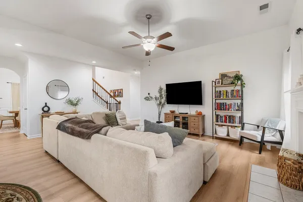 a living room with furniture and a flat screen tv