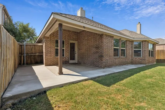a front view of a house with yard