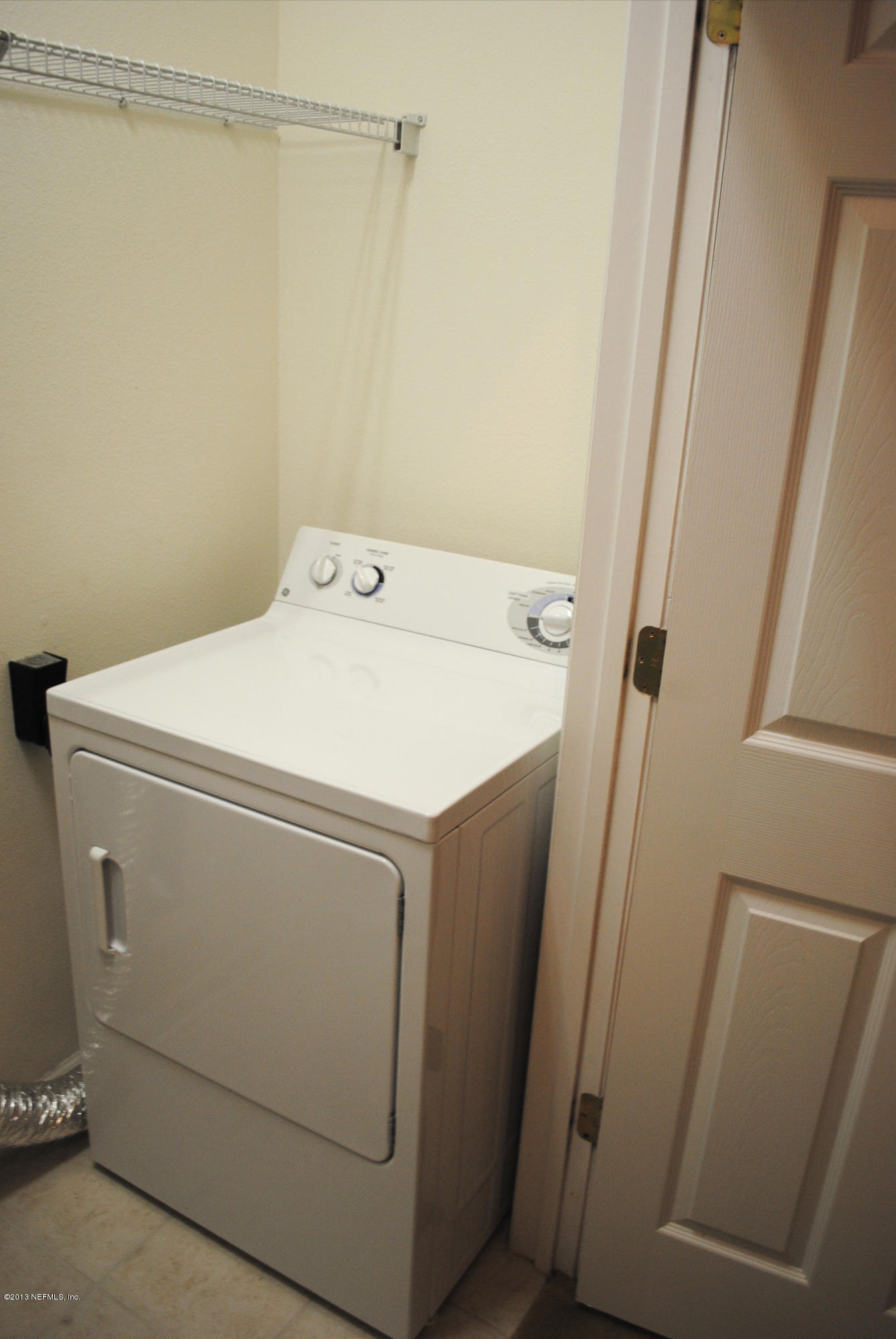 584 Crystal Way Orange Park, FL 32065 - Photo 12 of 22 a utility room with dryer and washer