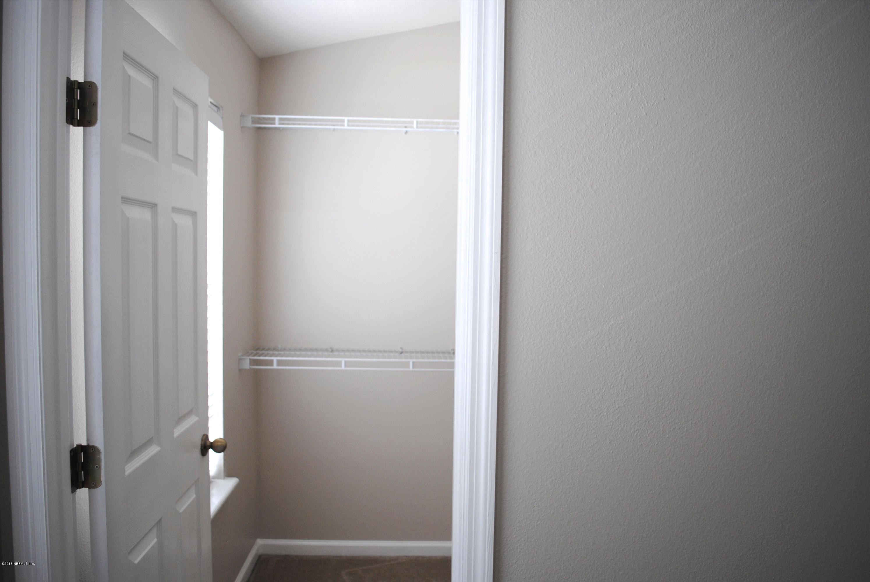 584 Crystal Way Orange Park, FL 32065 - Photo 14 of 22 a bathroom with a glass shower door