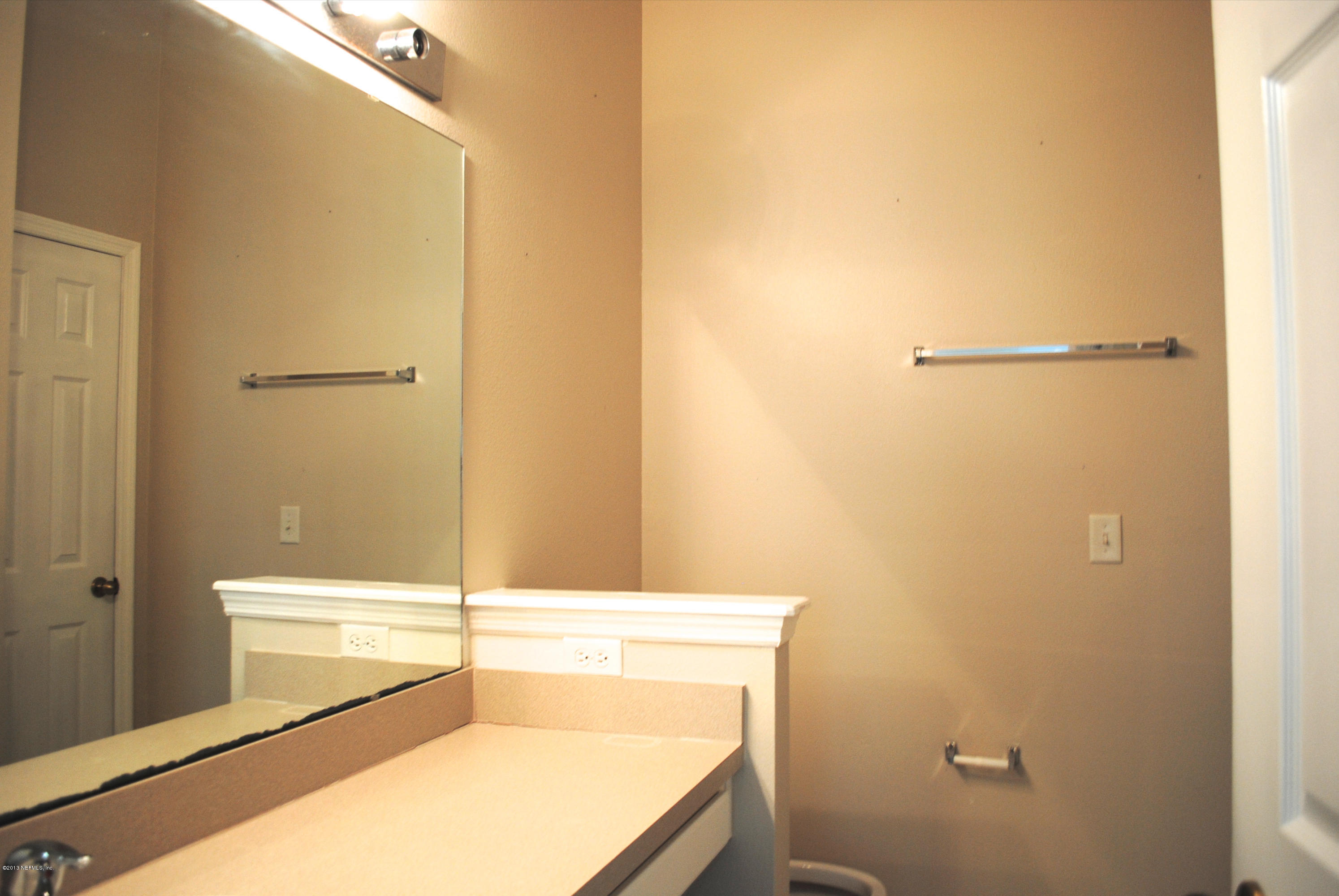 584 Crystal Way Orange Park, FL 32065 - Photo 17 of 22 a bathroom with a tub and a shower