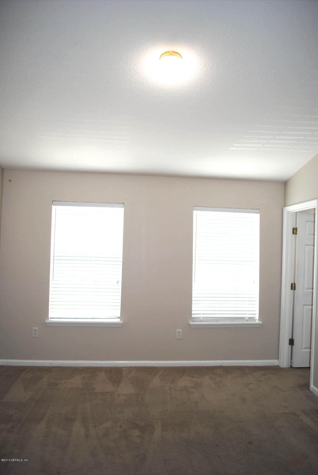 584 Crystal Way Orange Park, FL 32065 - Photo 18 of 22 an empty room with a window