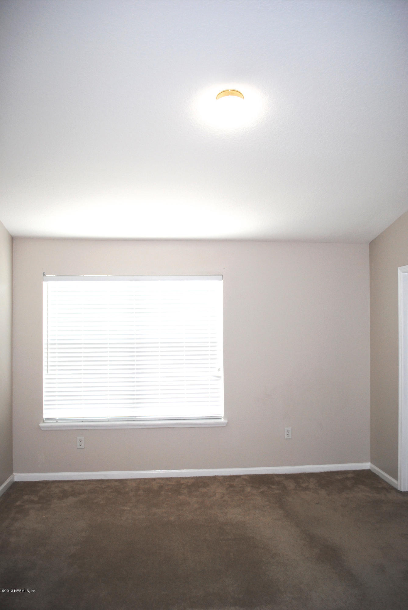 584 Crystal Way Orange Park, FL 32065 - Photo 19 of 22 an empty room with a window