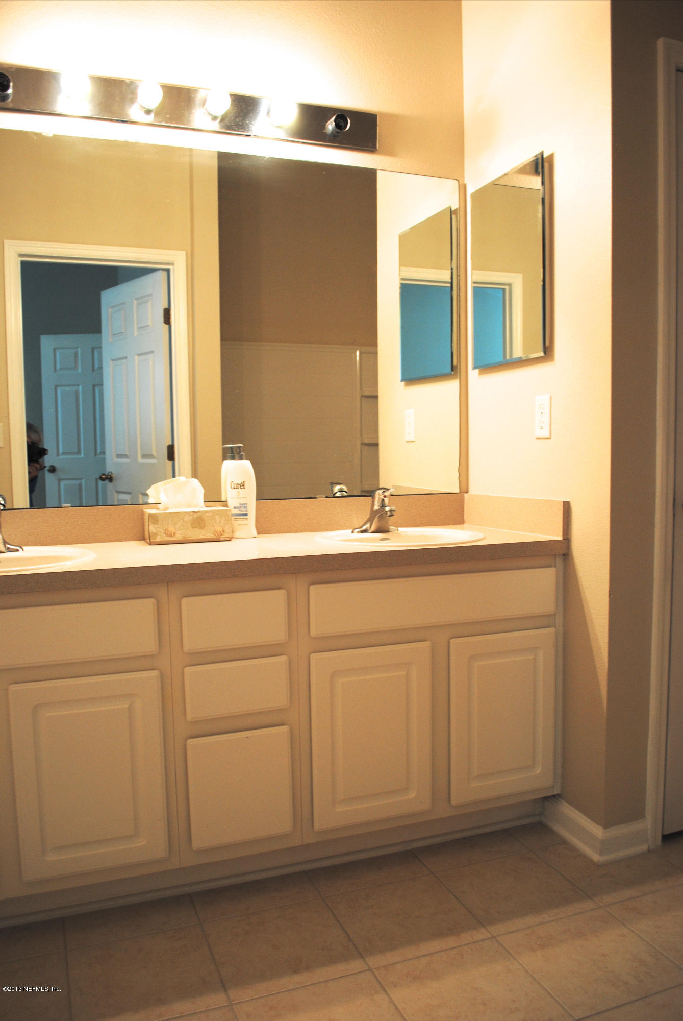 584 Crystal Way Orange Park, FL 32065 - Photo 20 of 22 a bathroom with a sink and a mirror
