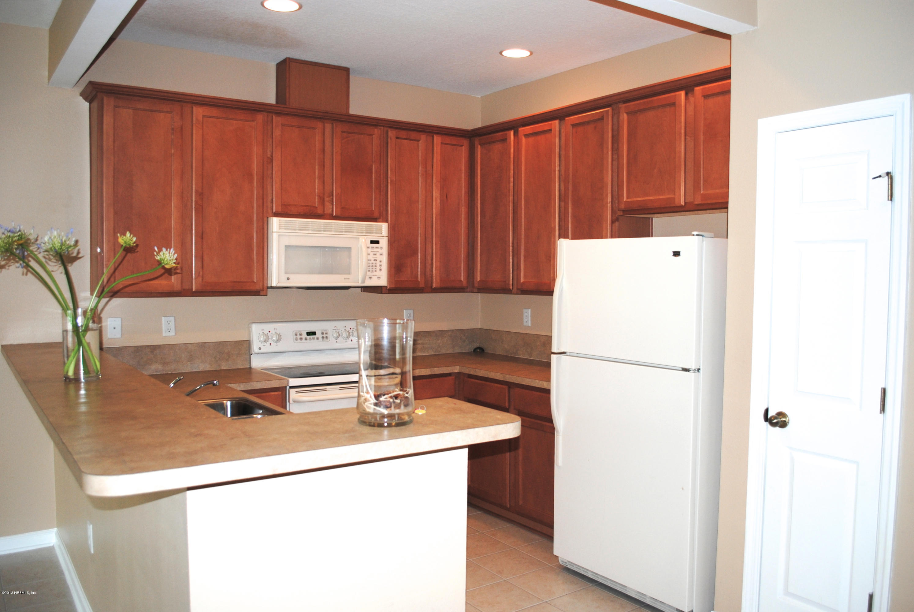584 Crystal Way Orange Park, FL 32065 - Photo 2 of 22 a utility room with dryer and washer