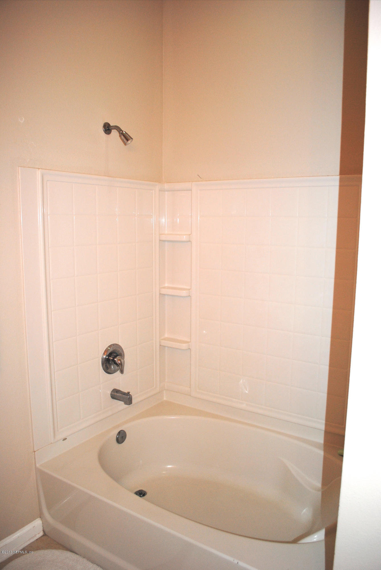 584 Crystal Way Orange Park, FL 32065 - Photo 21 of 22 a bathroom with a bathtub