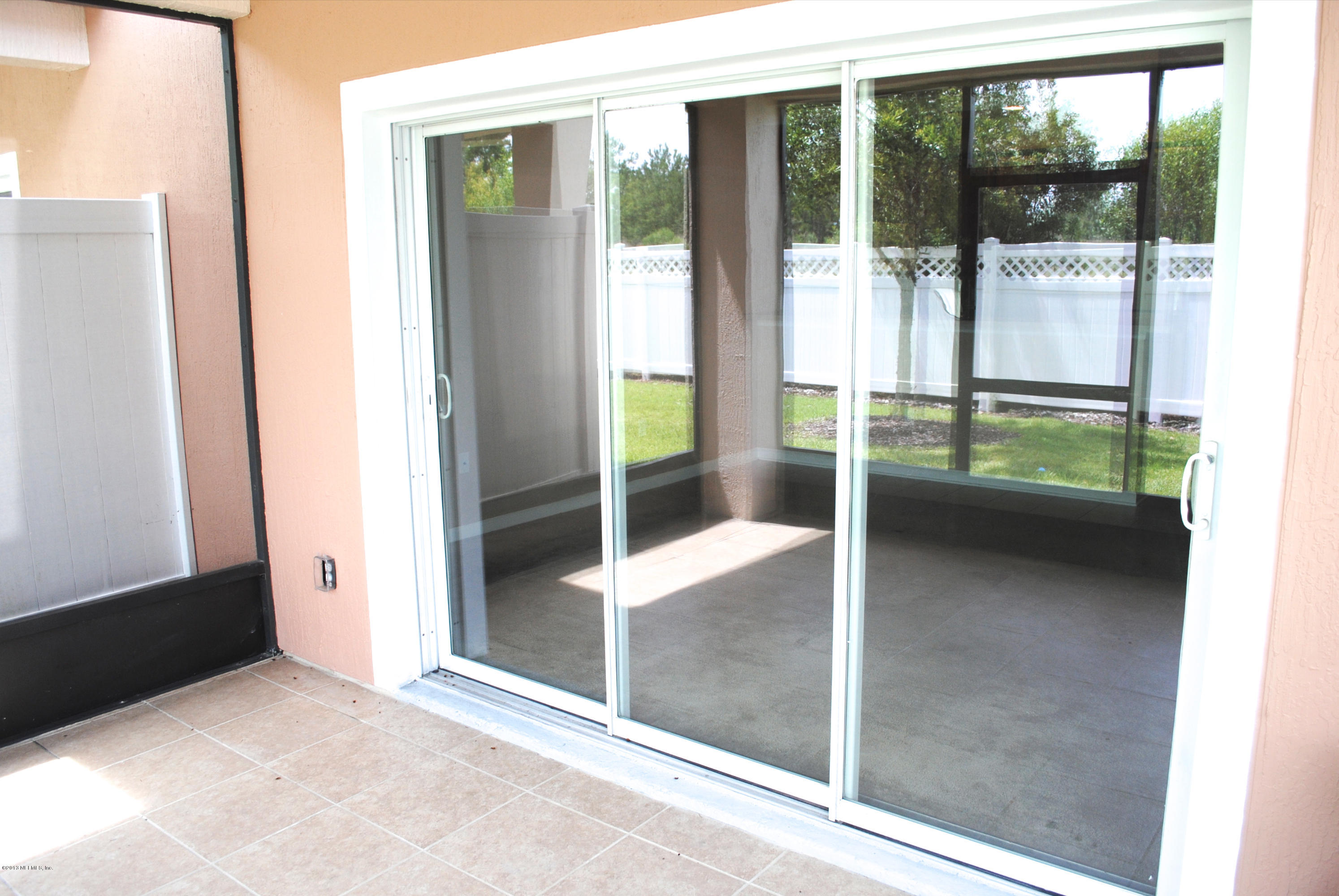 584 Crystal Way Orange Park, FL 32065 - Photo 7 of 22 a view of a large window with an outdoor space