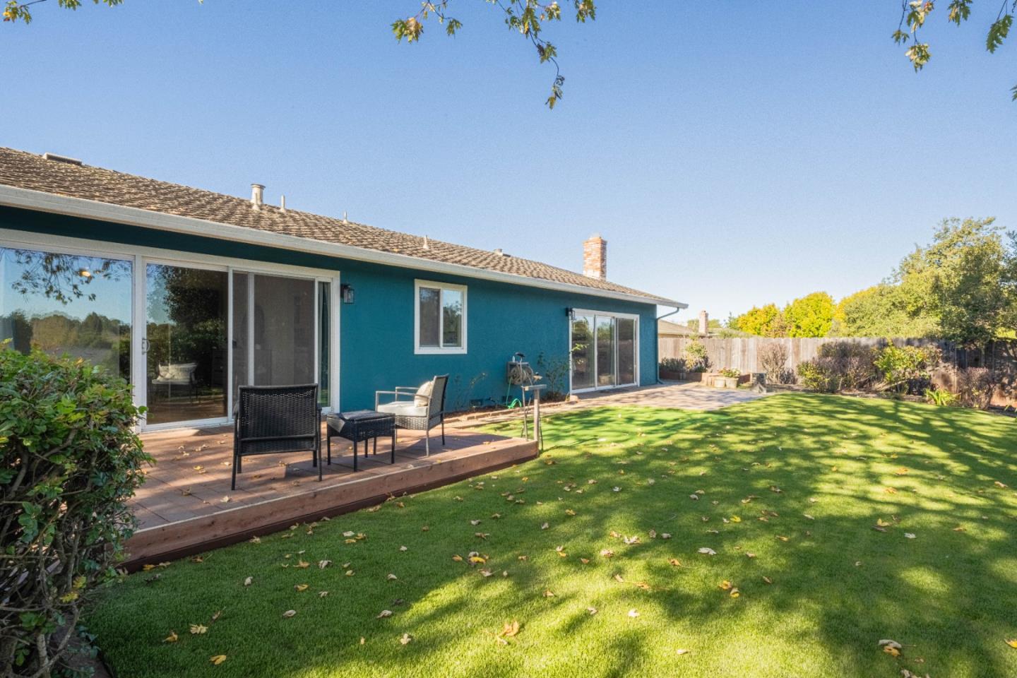 9919 Mimosa Path Salinas, CA 93907 - Photo 20 of 39 a backyard of a house with table and chairs and potted plants