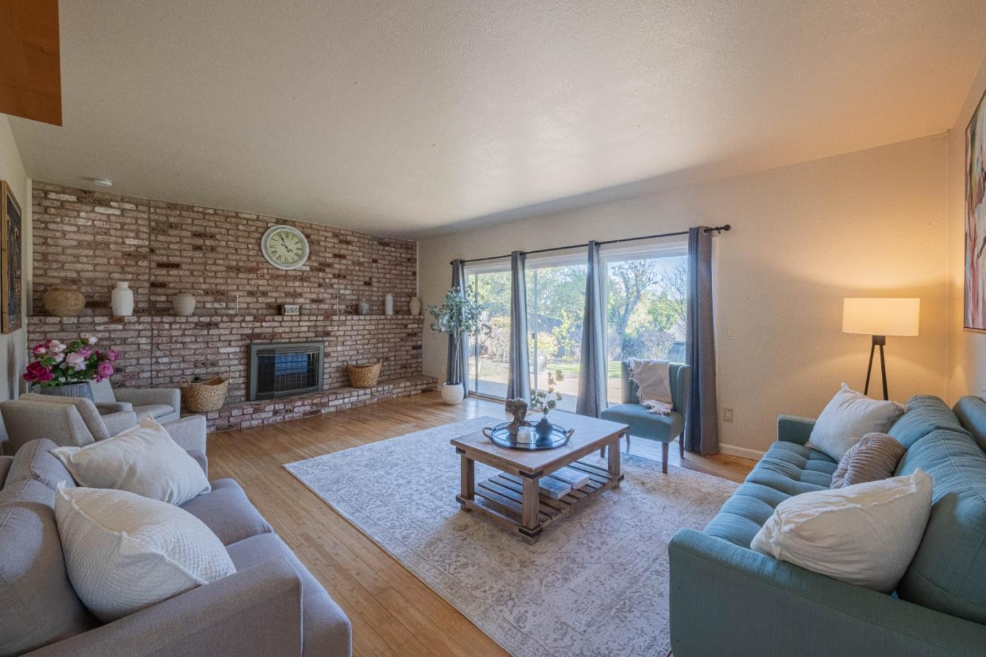 9919 Mimosa Path Salinas, CA 93907 - Photo 10 of 39 a living room with furniture and a fireplace