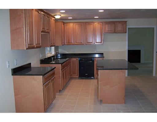 752 Mason Road Holden, MA 01522 - Photo 7 of 14 a kitchen with stainless steel appliances granite countertop a stove a sink and a microwave