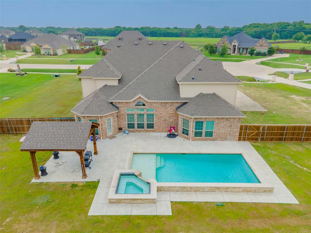 237 Stonegate Way Red Oak, TX 75154 - Photo 1 of 1 an aerial view of a house with a swimming pool