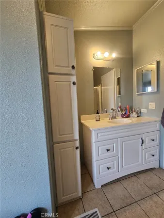 a bathroom with a double vanity sink and mirror