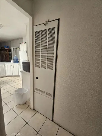 a bed sitting in a room next to a window