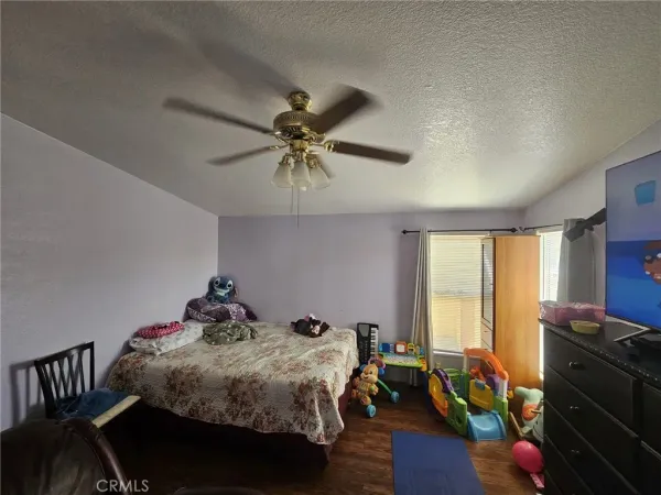 a bed sitting in a room next to a window