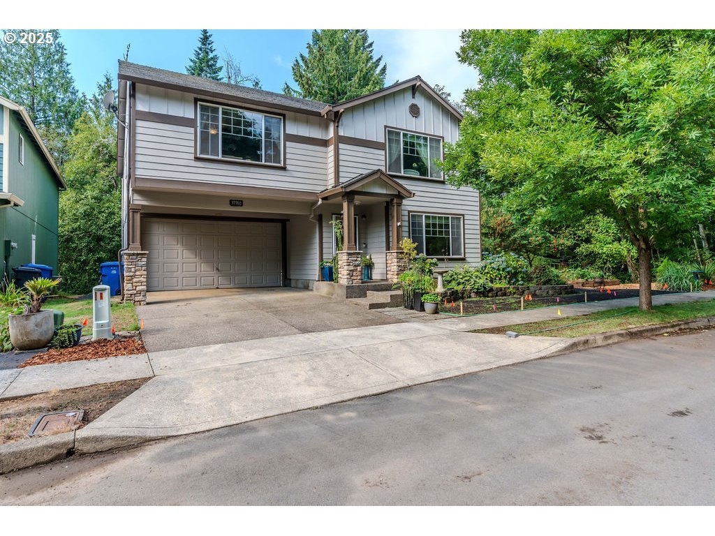 a front view of a house with a yard and garage