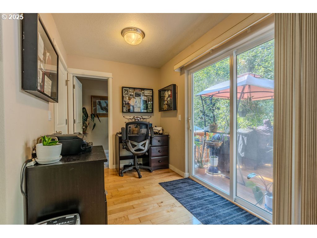 37702 Hamilton Ridge Drive Sandy, OR 97055 - Photo 18 of 44 a living room with furniture and a floor to ceiling window