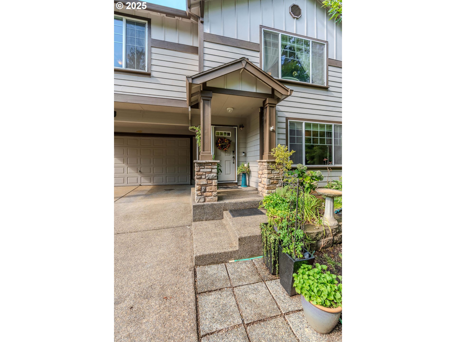 37702 Hamilton Ridge Drive Sandy, OR 97055 - Photo 2 of 44 a view of a house with a small yard and potted plants