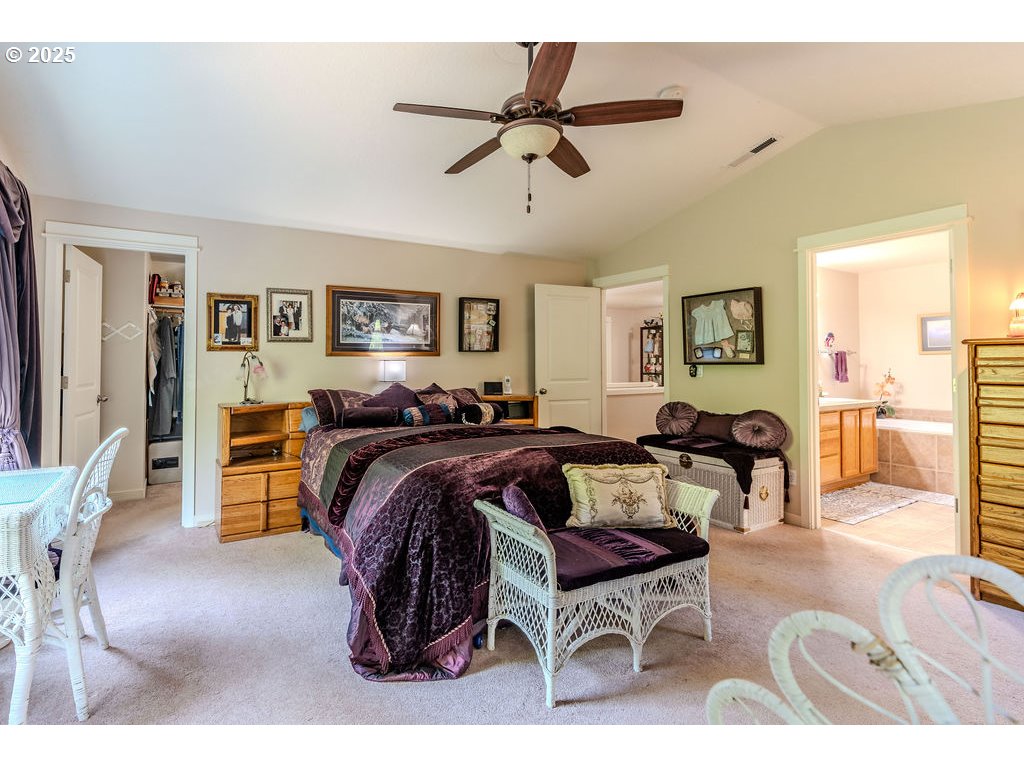 37702 Hamilton Ridge Drive Sandy, OR 97055 - Photo 25 of 44 a bed room with furniture and a ceiling fan