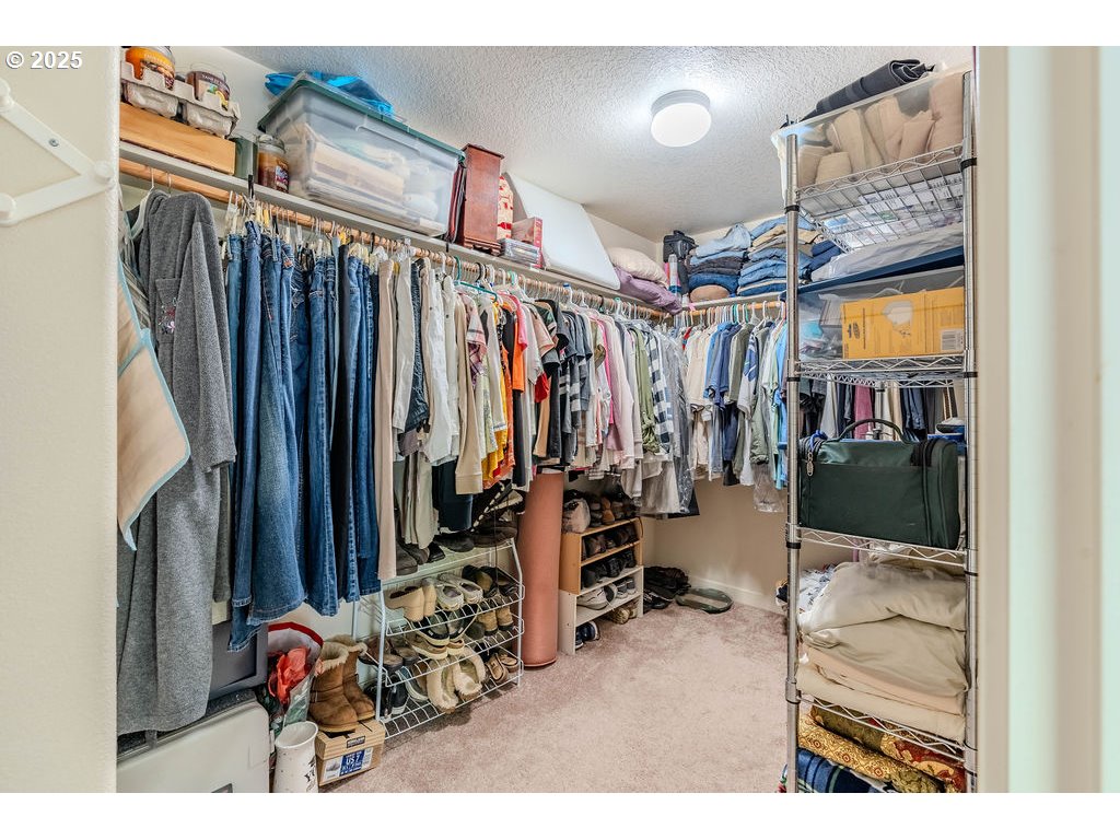 37702 Hamilton Ridge Drive Sandy, OR 97055 - Photo 29 of 44 a view of walk in closet with clothes