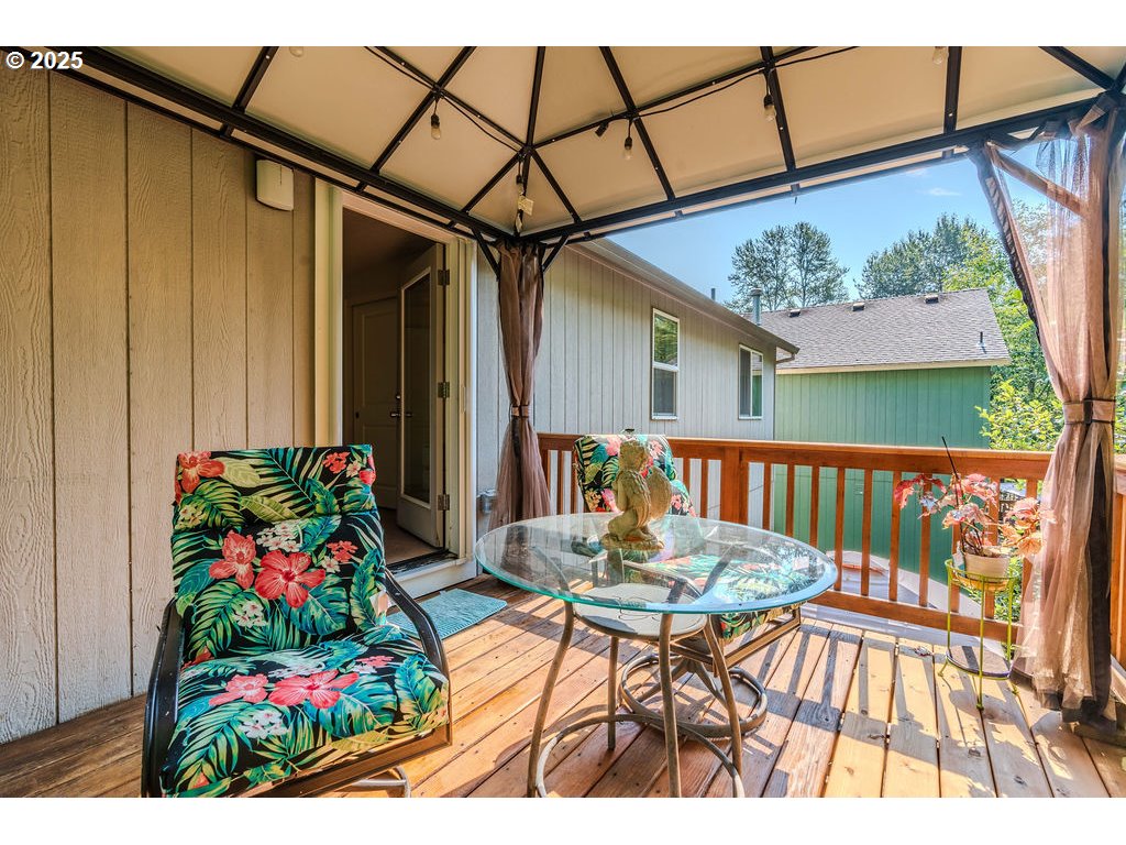 37702 Hamilton Ridge Drive Sandy, OR 97055 - Photo 31 of 44 a view of a chairs and table in the balcony