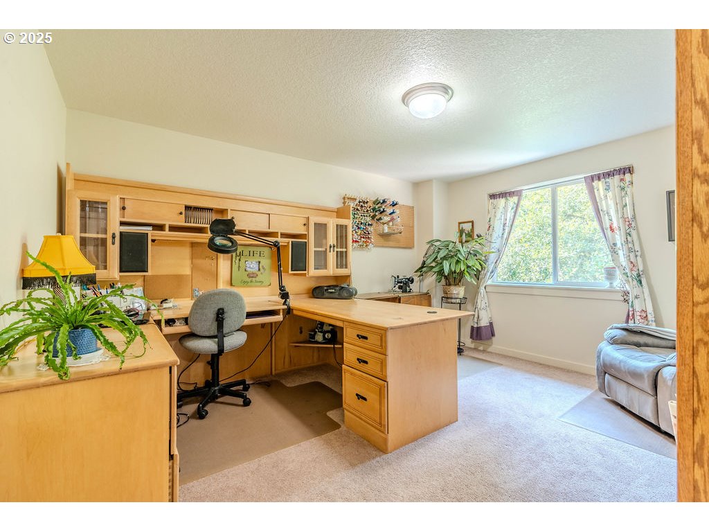 37702 Hamilton Ridge Drive Sandy, OR 97055 - Photo 33 of 44 a living room with furniture and a large window