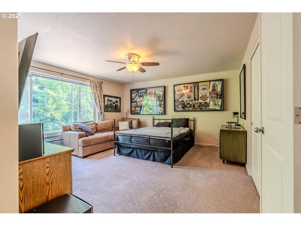 37702 Hamilton Ridge Drive Sandy, OR 97055 - Photo 34 of 44 a living room with furniture and a large window