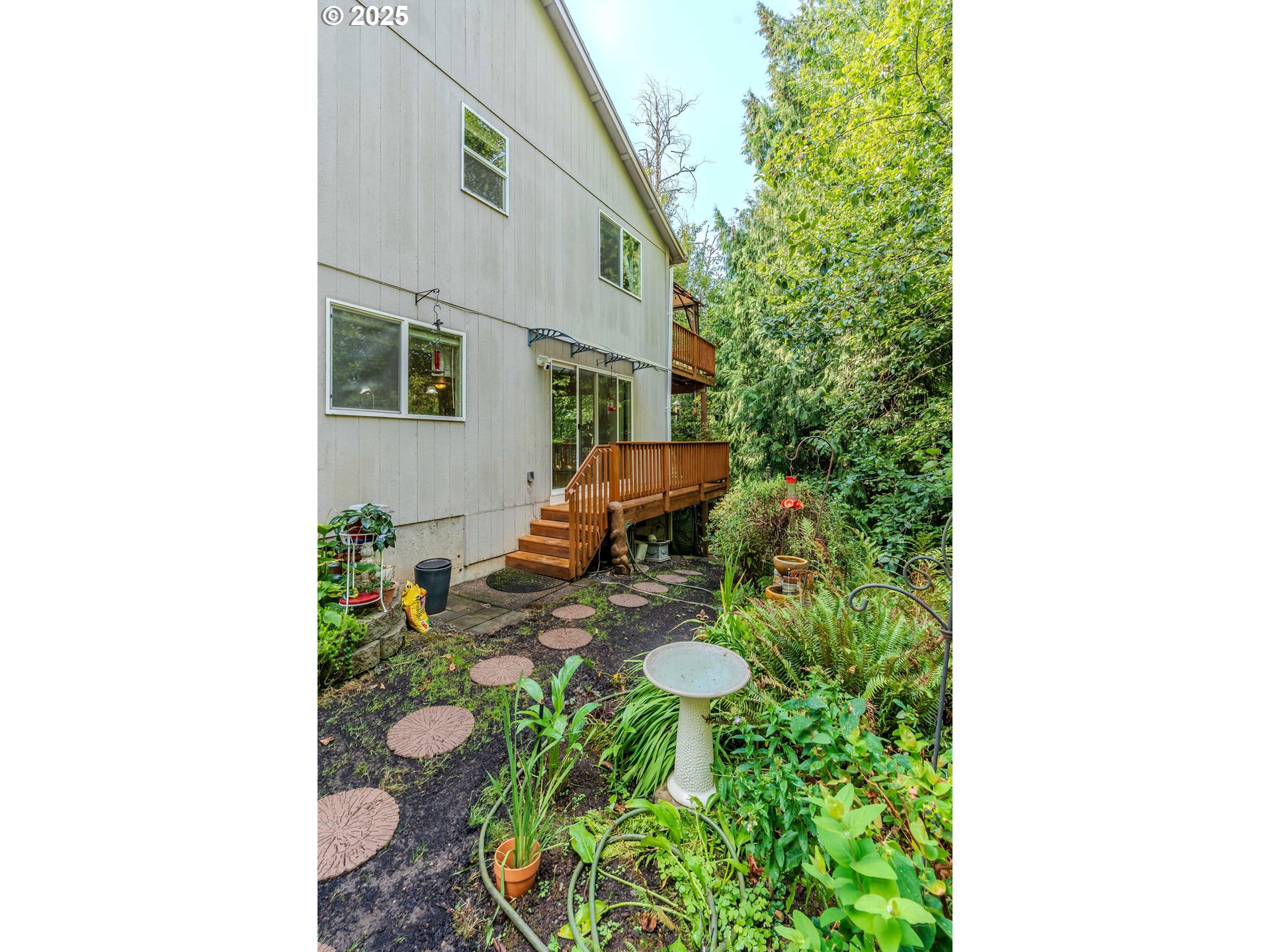37702 Hamilton Ridge Drive Sandy, OR 97055 - Photo 6 of 44 a view of a house with a backyard and sitting area
