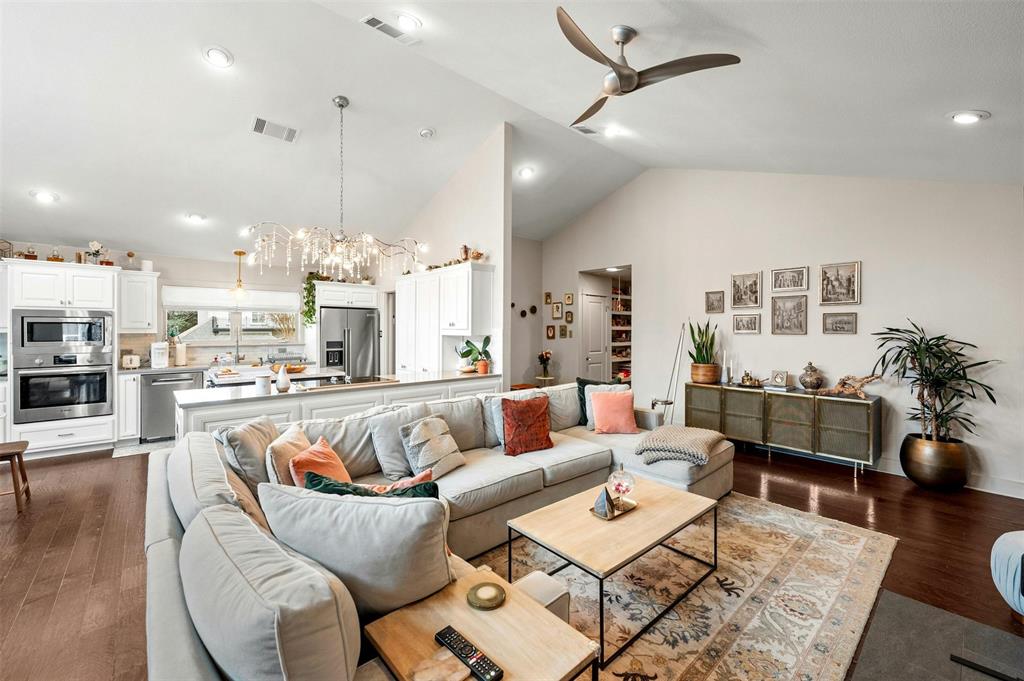 2802 Warren Street, Unit A Austin, TX 78703 - Photo 5 of 29 a living room with furniture kitchen view and a wooden floor