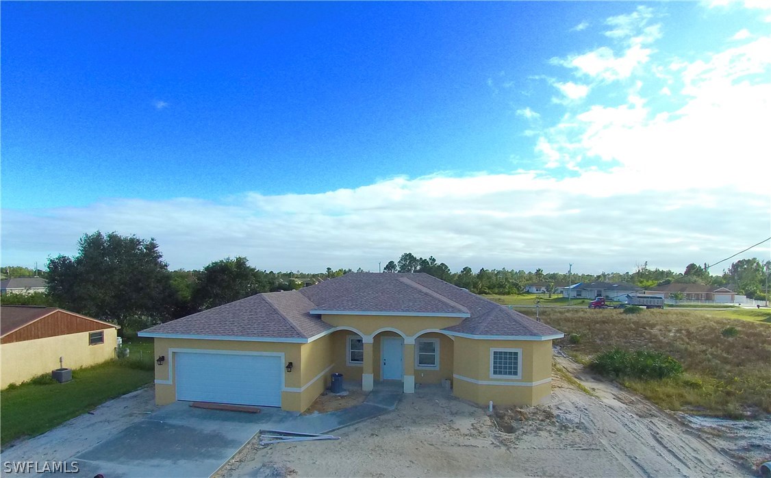 3403 35th Street Southwest Lehigh Acres, FL 33976 - Photo 1 of 7 a aerial view of a house