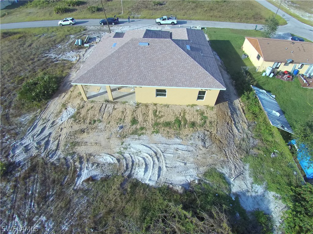 3403 35th Street Southwest Lehigh Acres, FL 33976 - Photo 2 of 7 an aerial view of a house