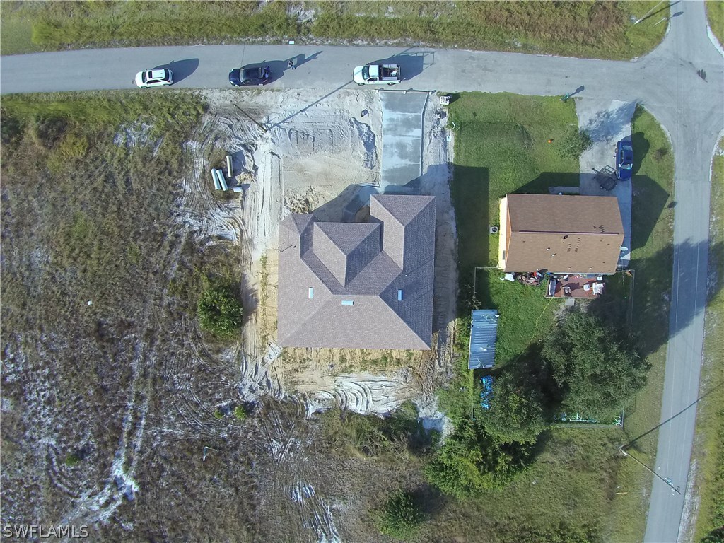 3403 35th Street Southwest Lehigh Acres, FL 33976 - Photo 3 of 7 an aerial view of houses with outdoor space