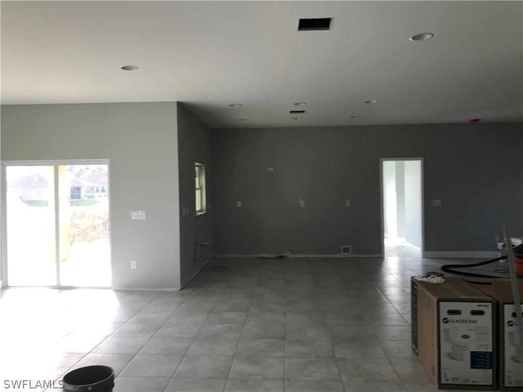 3403 35th Street Southwest Lehigh Acres, FL 33976 - Photo 7 of 7 an empty room with windows